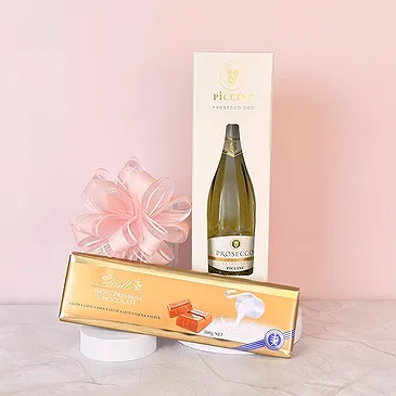 Riga-virágok- Prosecco és Lindt XL csokoládé szelet Virágkötészeti csokor
