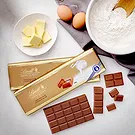 Riga-virágok- Prosecco és Lindt XL csokoládé szelet Virágkötészeti csokor